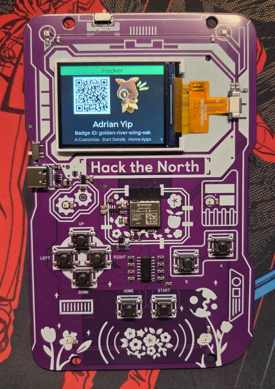 Hack the North 2026 hardware badge with Adrian Yip's name on the screen
